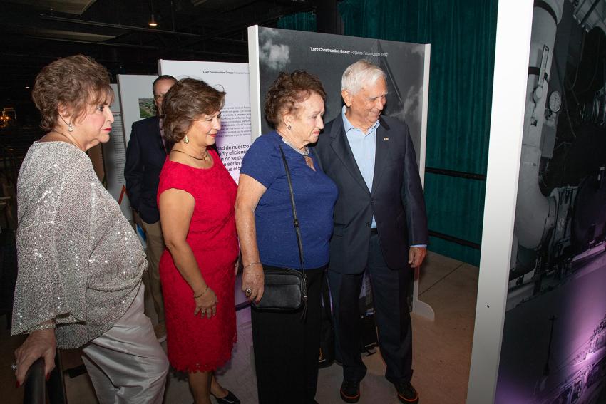 People walking through exhibit