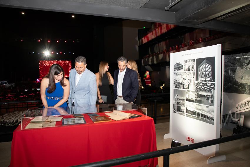 People walking through exhibit