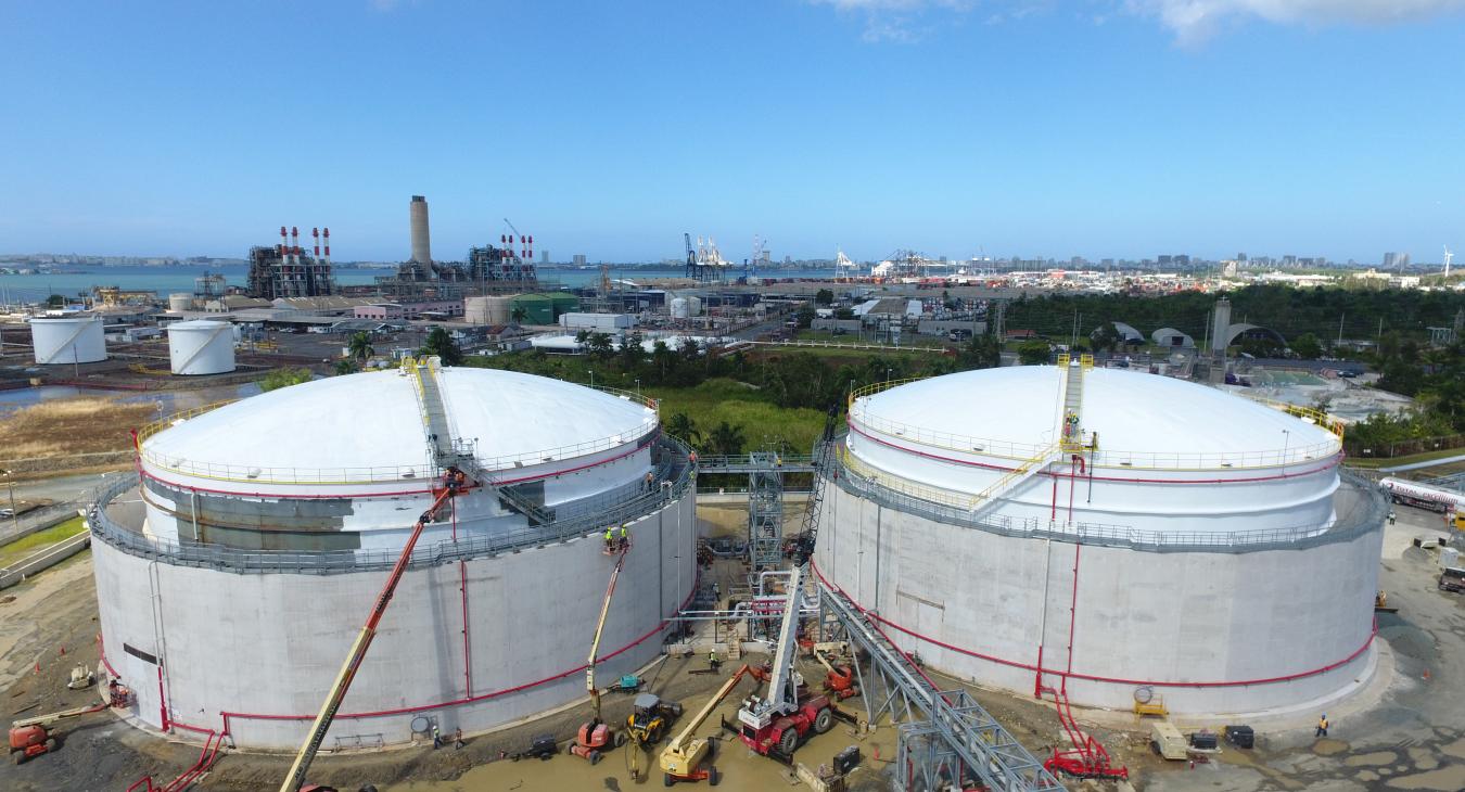 Aerial view of large holding tanks under construction