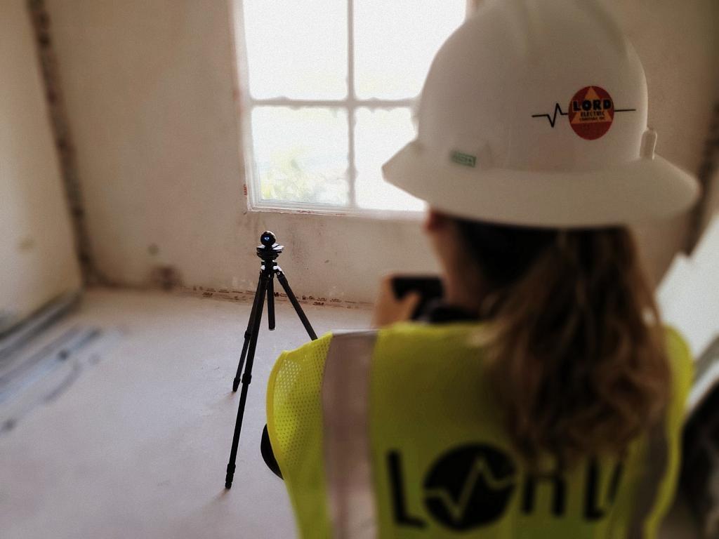 Woman in Hardhat Surveying